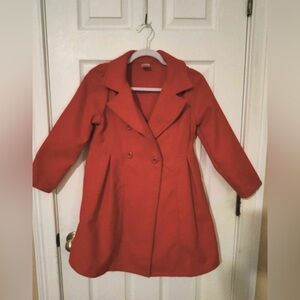 Red girls coat by the brand Just Kids.